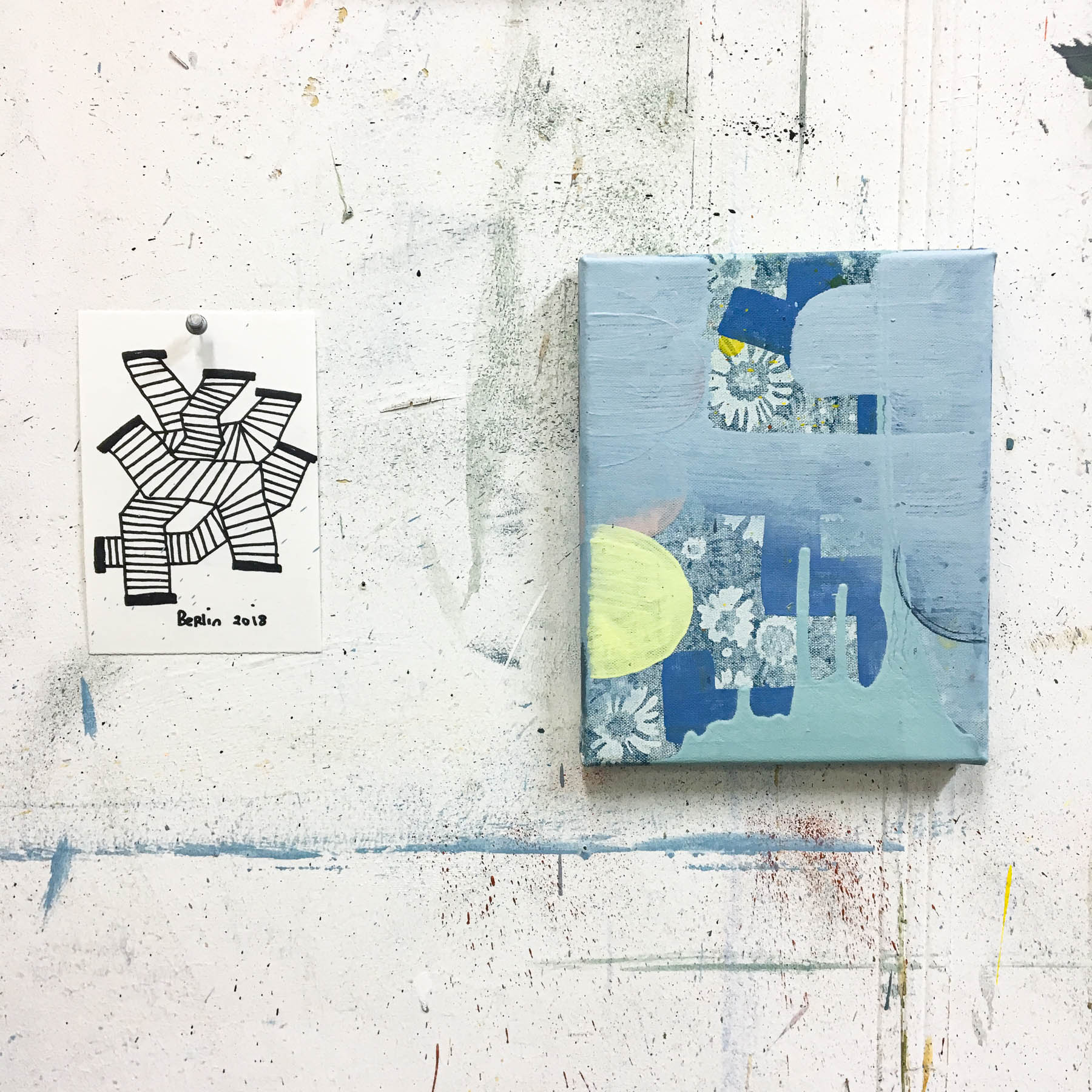 Abstract artwork on a textured white surface